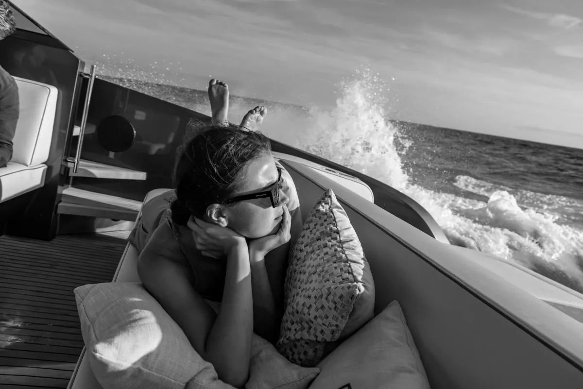 Guest watching the spray from the aft lounge