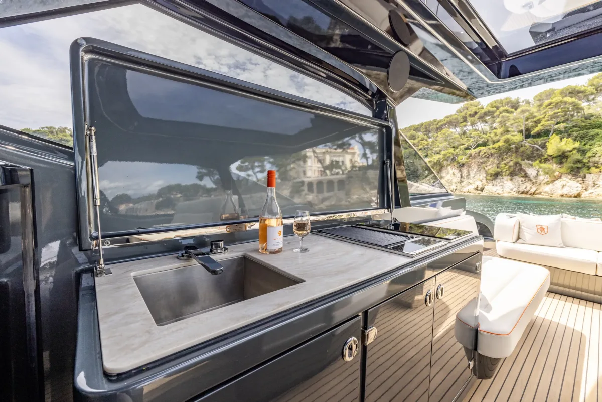 Outdoor galley of the AZUR 45HT with marble top, sink, grill and induction cooker